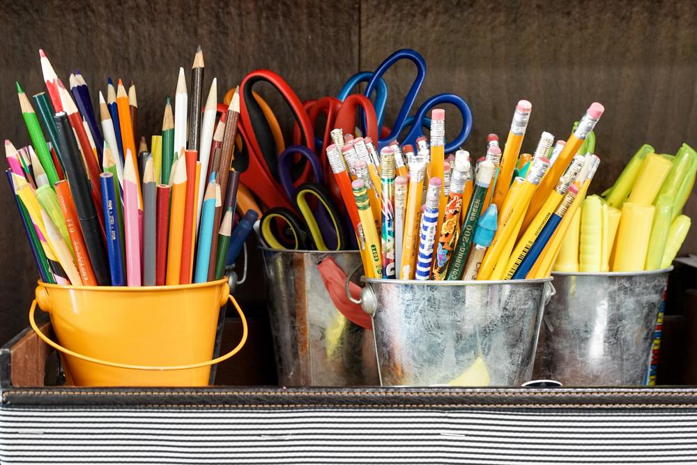 Colored pencils, pencils, and scissors