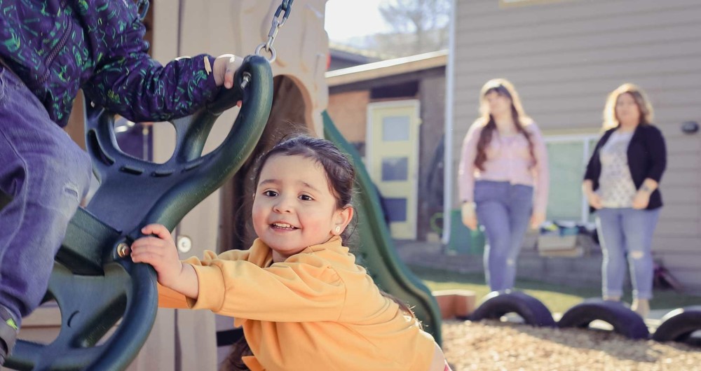 preschool child with swing